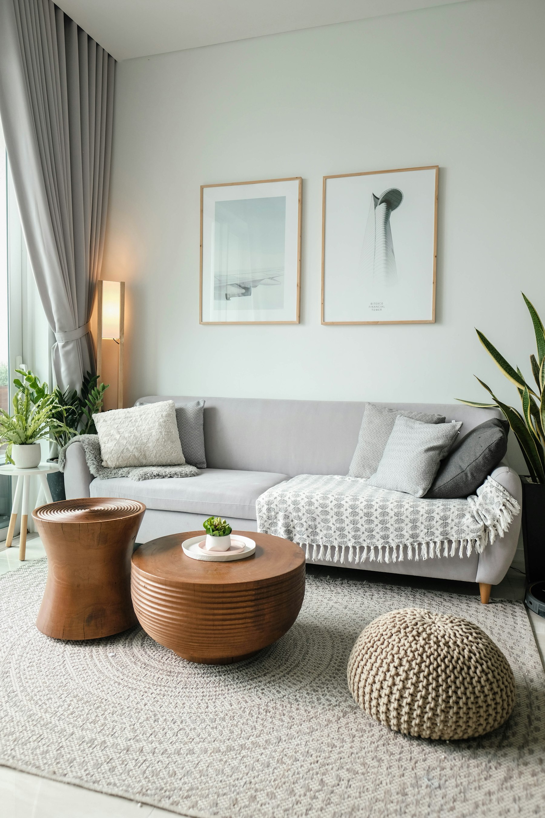 Warm living room with soft seating, plants, and layered textures